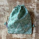 Pochettes - Pochette de maillot de bain ethnique verte et blanche Banhi - TERRE AMBRÉE