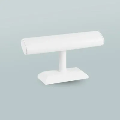 Gifts - Angled bracelet display stand on a smooth-looking white, upholstered base - LAVAL 1878