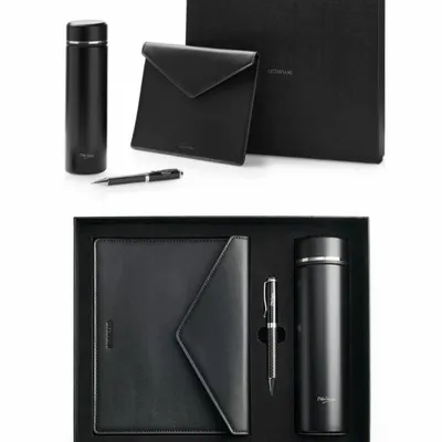 Objets design - Ensemble comprenant un stylo, une bouteille isotherme en acier inoxydable et un porte-documents en cuir véritable. - OTTAVIANI
