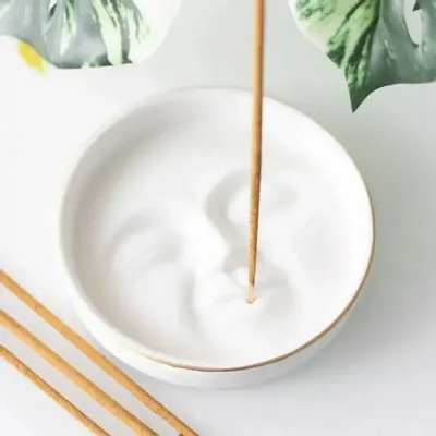 Scents - White Moon Face Incense Stick Holder - SOMETHING DIFFERENT WHOLESALE EUROPE BV