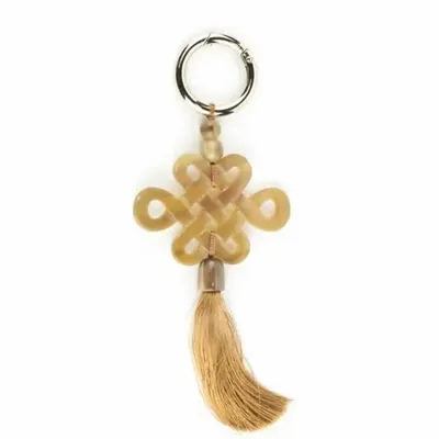 Leather goods - Tibetan charm in blond horn and brown thread - L INDOCHINEUR X RIVÊT