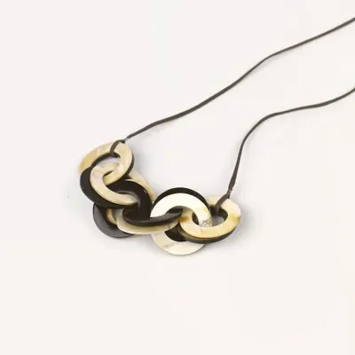 Jewelry - Interlaced rings pendant in blond and black horn - L INDOCHINEUR X RIVÊT