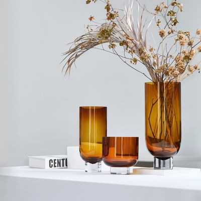 Vases - Sober modern glass vase, cylindrical shape on a solid base, amber or grey, OMAHA14 AM/GR - ELEMENT ACCESSORIES