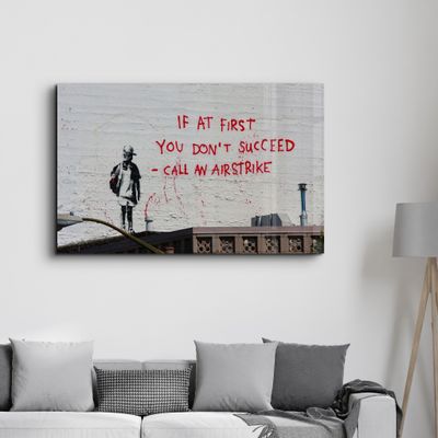 Other wall decoration - Banksy - Call an Airstrike | Glass Wall Art  110CMx70CM - ARTDESIGNA
