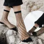 Cadeaux - Crescent Dunes Black 39-41 : chaussettes transparentes à pois - ATELIER ST EUSTACHE