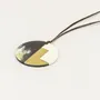 Jewelry - Disc pendant in black African horn, ivory lacquer and brass - L INDOCHINEUR X RIVÊT