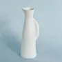 Vases - Like an attentive meerkat, the porcelain pitcher stands in quiet vigil - TSÉ & TSÉ