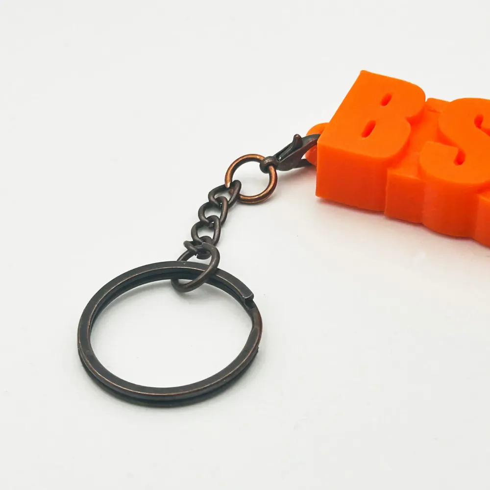 Petite maroquinerie - Porte-clés à message – BISOU - MAUVAISES GRAINES