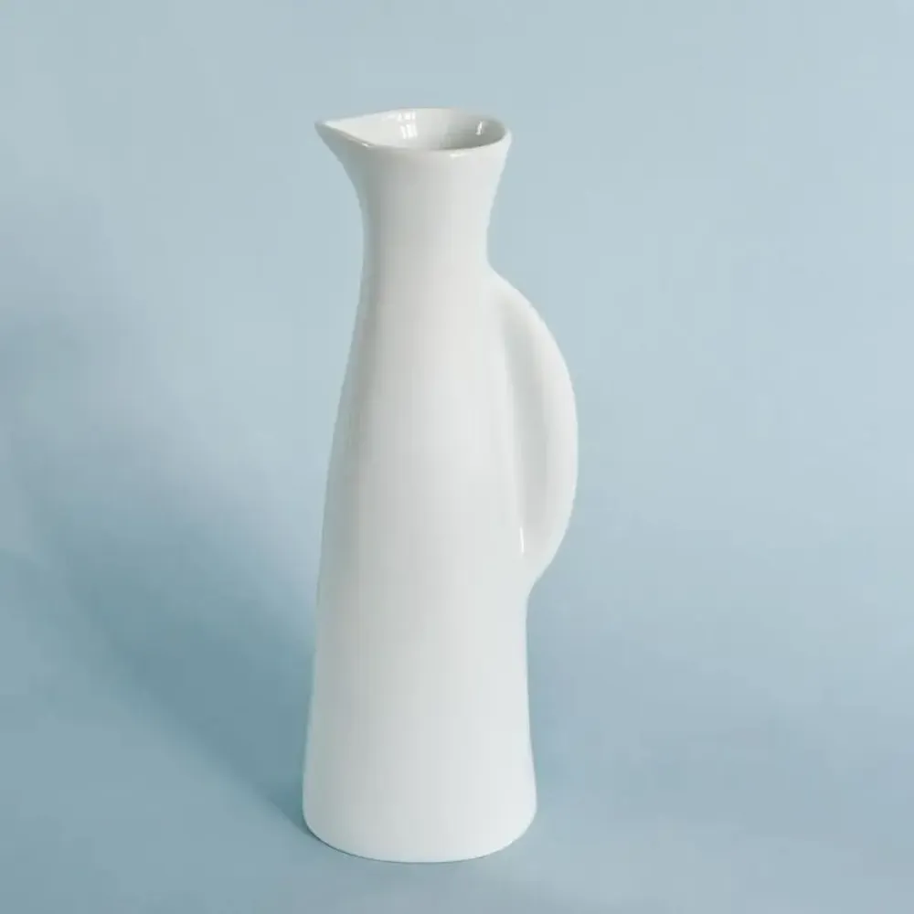 Vases - Like an attentive meerkat, the porcelain pitcher stands in quiet vigil - TSÉ & TSÉ