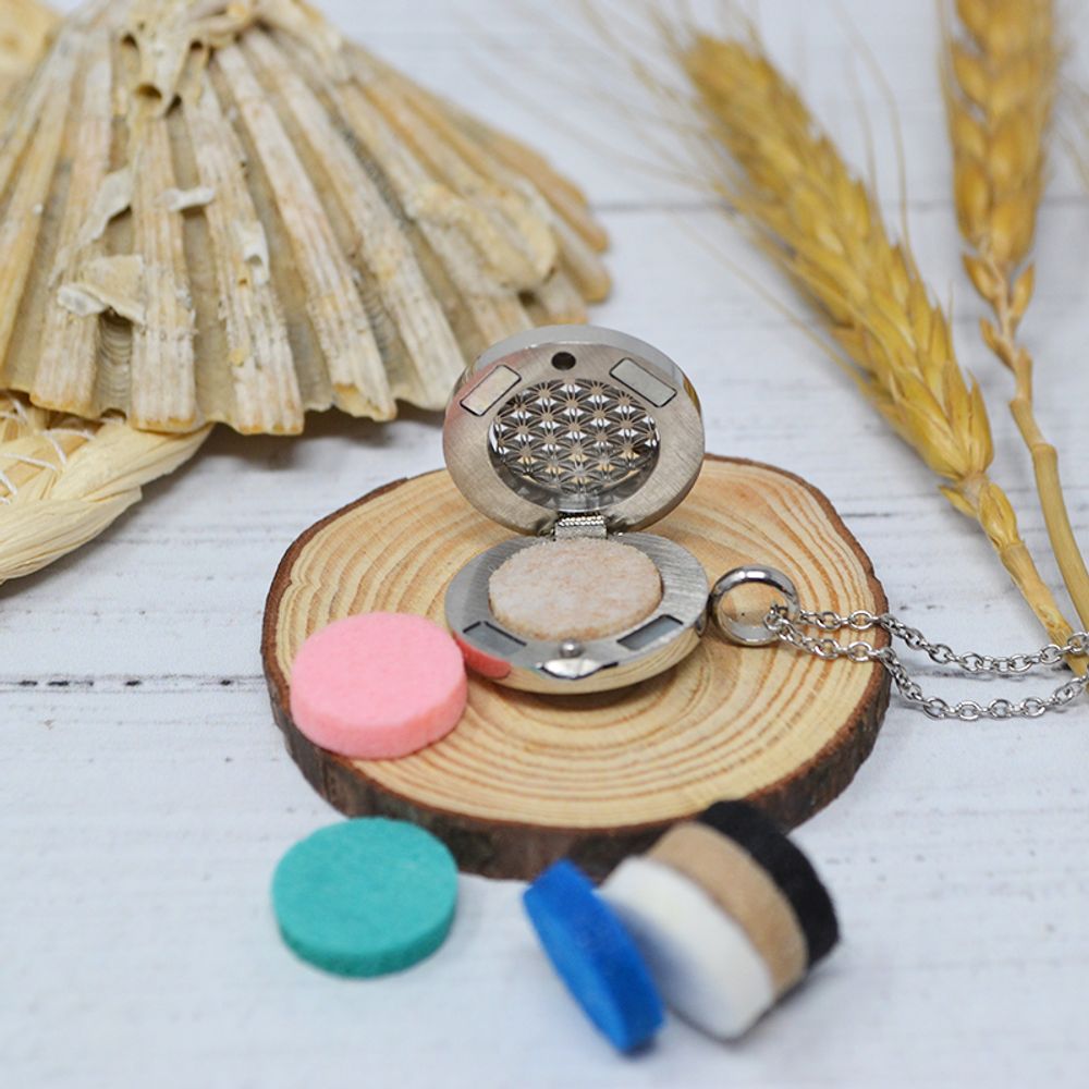 Diffuseurs de parfums - Collier diffuseur médaillon - FLEUR DE VIE (7 patins en feutre) - IRRÉVERSIBLE